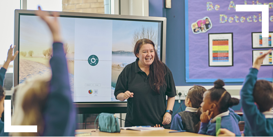 teacher asking questions to young class